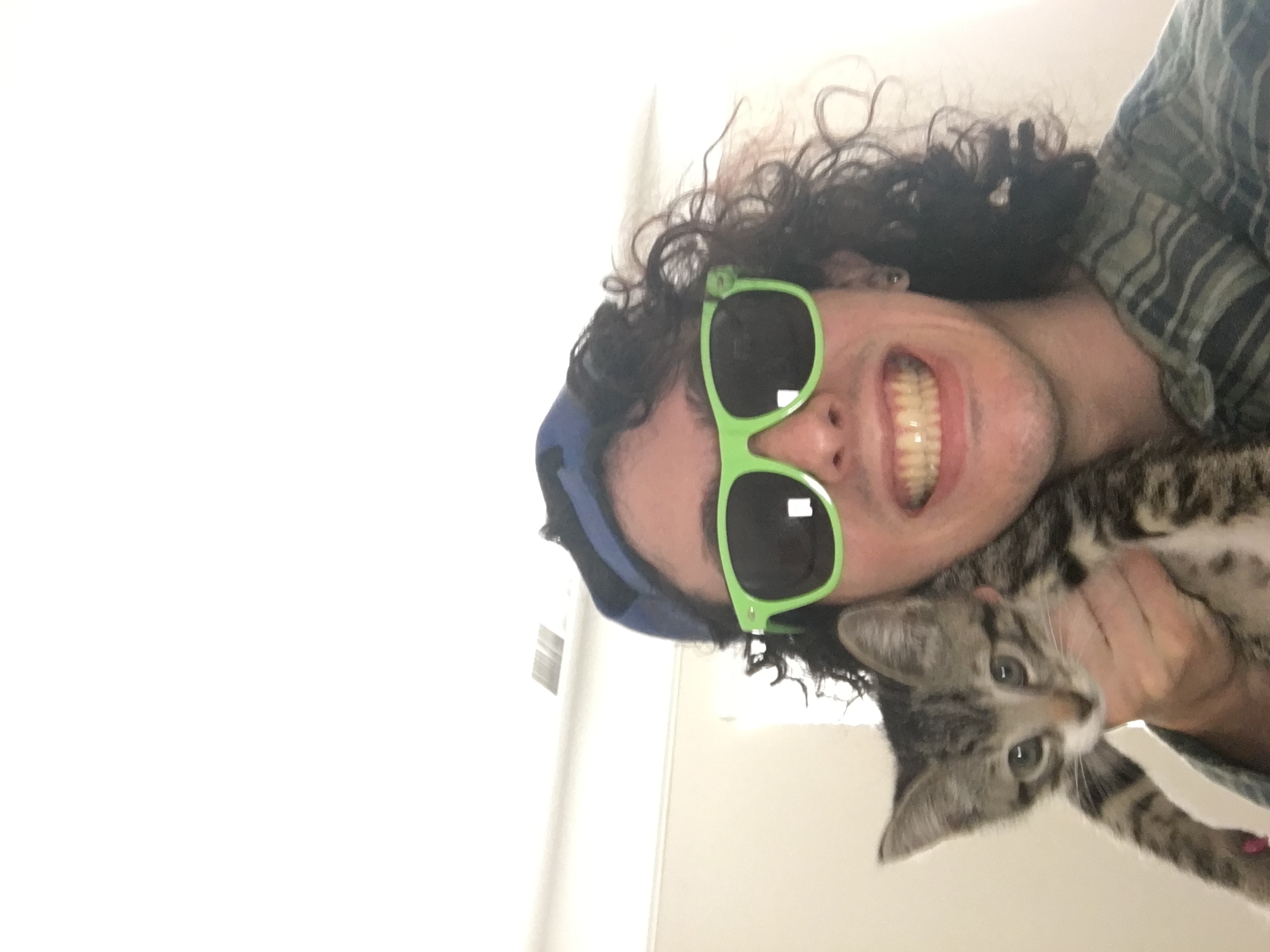 Styx in weird glasses holding Crouton like a ferret